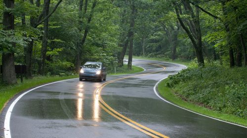 Wet twisty hazardous road with Prius